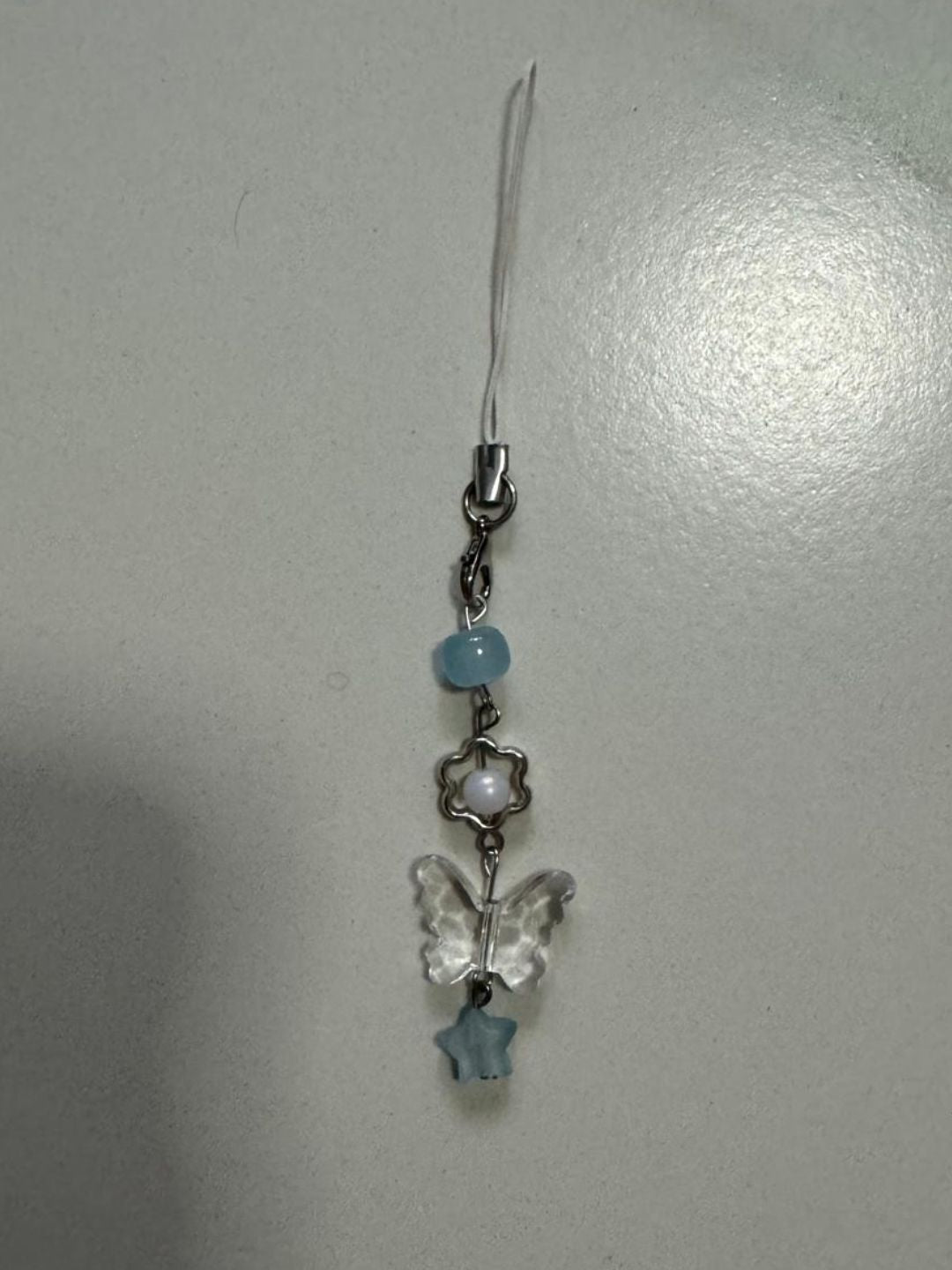 blue butterfly phonecharm
