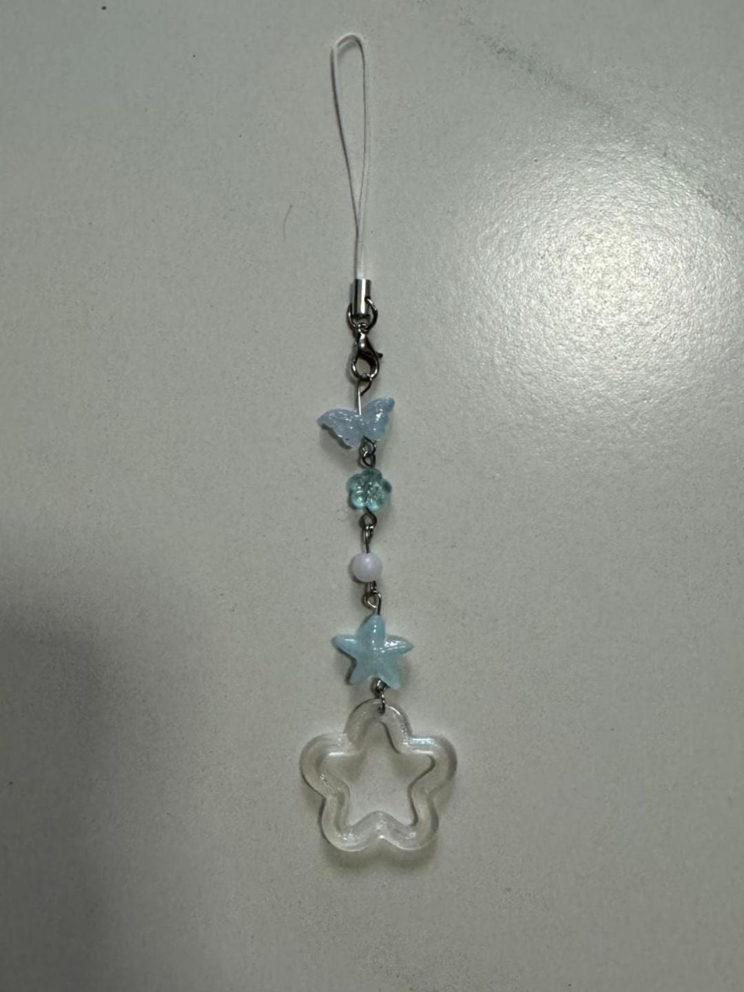 random blue star phone charm